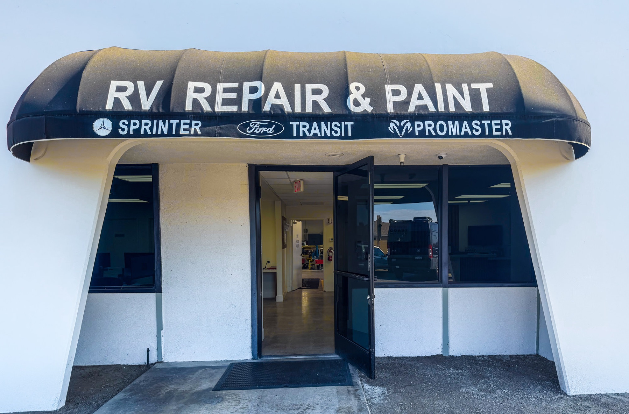 Orange Coast shop entrance and van repair signage on Talbert Avenue